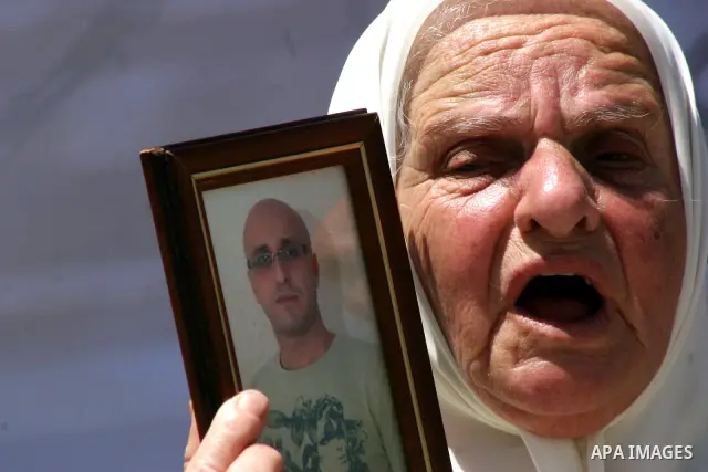 Palestinians hold portraits of relatives jailed in Israeli prisons as they protest to demand for their release, in the Al Aqsa Mosque compound in Jerusalem's Old City, on April 27, 2012. After decades of shying away from...