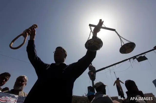People attend Friday prayers in Tahrir Square in Cairo April 27, 2012. Tens of thousands of Egyptians demanded on Friday that their military rulers stick to a pledge to hand over power by mid-year after a row over who ca...