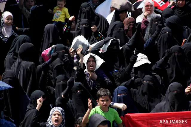 People attend Friday prayers in Tahrir Square in Cairo April 27, 2012. Tens of thousands of Egyptians demanded on Friday that their military rulers stick to a pledge to hand over power by mid-year after a row over who ca...