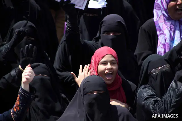 People attend Friday prayers in Tahrir Square in Cairo April 27, 2012. Tens of thousands of Egyptians demanded on Friday that their military rulers stick to a pledge to hand over power by mid-year after a row over who ca...
