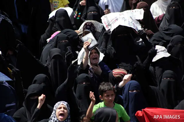 People attend Friday prayers in Tahrir Square in Cairo April 27, 2012. Tens of thousands of Egyptians demanded on Friday that their military rulers stick to a pledge to hand over power by mid-year after a row over who ca...