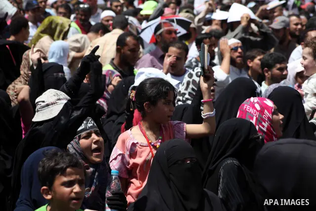 People attend Friday prayers in Tahrir Square in Cairo April 27, 2012. Tens of thousands of Egyptians demanded on Friday that their military rulers stick to a pledge to hand over power by mid-year after a row over who ca...
