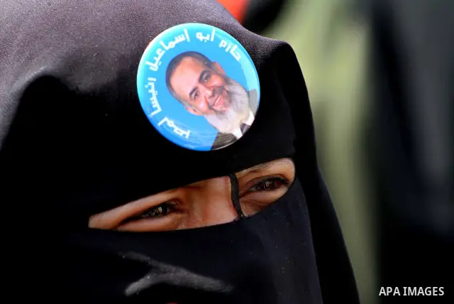 People attend Friday prayers in Tahrir Square in Cairo April 27, 2012. Tens of thousands of Egyptians demanded on Friday that their military rulers stick to a pledge to hand over power by mid-year after a row over who ca...