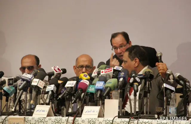 Egyptian Nobel Peace Prize winner and former head of the International Atomic Energy Agency, Mohamed ElBaradei addresses a press conference with novelist Alaa al-Aswany and other personalities, at the Egyptian Press Synd...