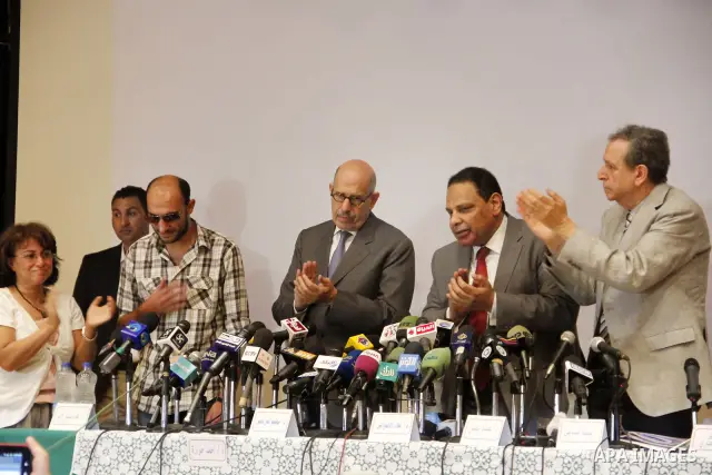 Egyptian Nobel Peace Prize winner and former head of the International Atomic Energy Agency, Mohamed ElBaradei addresses a press conference with novelist Alaa al-Aswany and other personalities, at the Egyptian Press Synd...