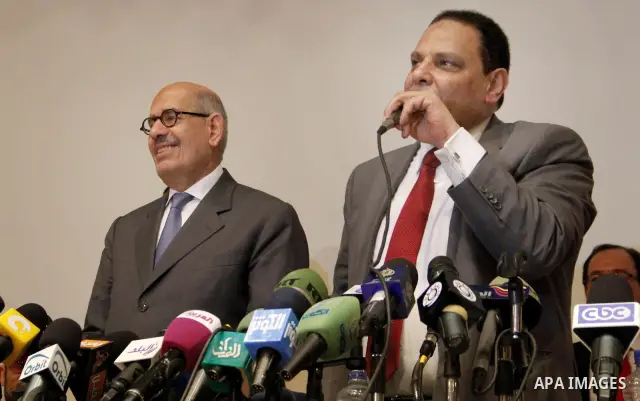 Egyptian Nobel Peace Prize winner and former head of the International Atomic Energy Agency, Mohamed ElBaradei addresses a press conference with novelist Alaa al-Aswany and other personalities, at the Egyptian Press Synd...