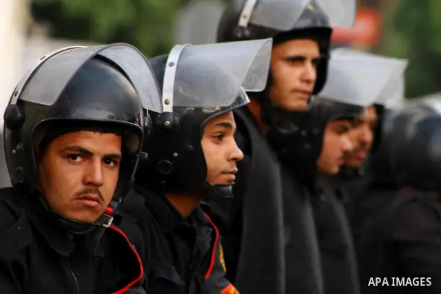 Egyptian security forces stand guard outside the Saudi Embassy in Cairo, Egypt during a demonstration to demand the release of an Egyptian human rights lawyer detained in Saudi Arabia for allegedly insulting the kingdom'...