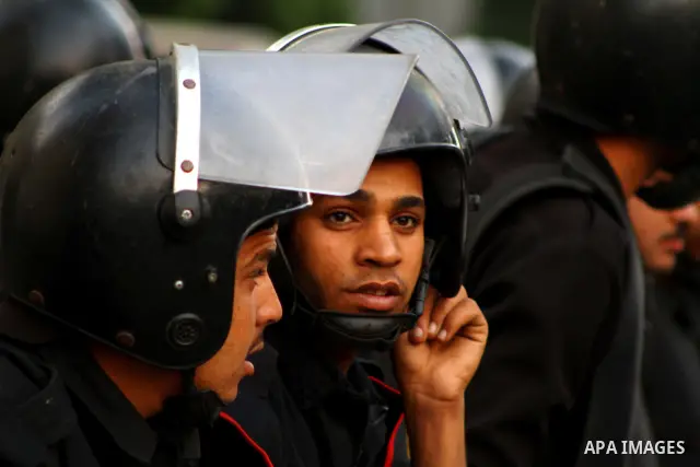Egyptian security forces stand guard outside the Saudi Embassy in Cairo, Egypt during a demonstration to demand the release of an Egyptian human rights lawyer detained in Saudi Arabia for allegedly insulting the kingdom'...