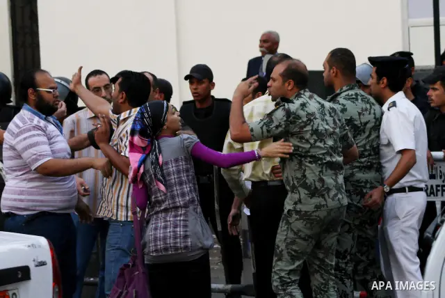 An Egyptian Army officer argues with protesters demonstrating in front of the Saudi Embassy in Cairo, Egypt to demand the release of an Egyptian human rights lawyer detained in Saudi Arabia for allegedly insulting the ki...