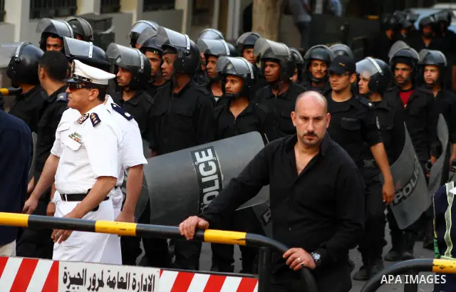 Egyptian security forces stand guard outside the Saudi Embassy in Cairo, Egypt during a demonstration to demand the release of an Egyptian human rights lawyer detained in Saudi Arabia for allegedly insulting the kingdom'...