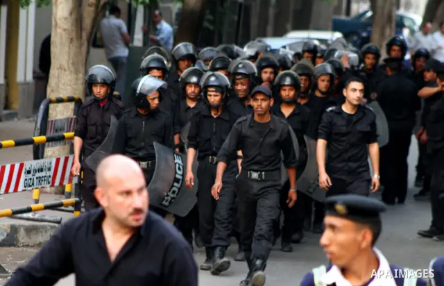 Egyptian security forces stand guard outside the Saudi Embassy in Cairo, Egypt during a demonstration to demand the release of an Egyptian human rights lawyer detained in Saudi Arabia for allegedly insulting the kingdom'...