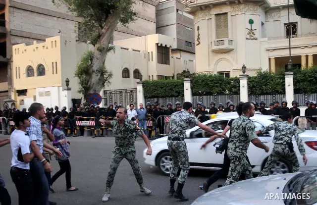 Egyptian security forces detain protesters demonstrating outside the Saudi embassy in Cairo on April 28, 2012. Saudi Arabia has decided to recall its ambassador to Cairo and close diplomatic missions in Egypt after prote...