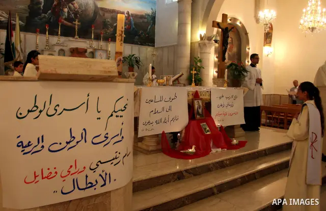 Palestinian Christians attend a special service in support of jailed Palestinians on hunger strike in Israeli prisons at a church in the West Bank city of Ramallah on April 29, 2012. Over the past week, Over 1,350 Palest...