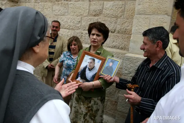 Palestinian priests and Christians, protest in support of jailed Palestinians on hunger strike in Israeli prisons in the West Bank city of Ramallah on April 29, 2012. Over the past week, over 1,350 Palestinian prisoners...