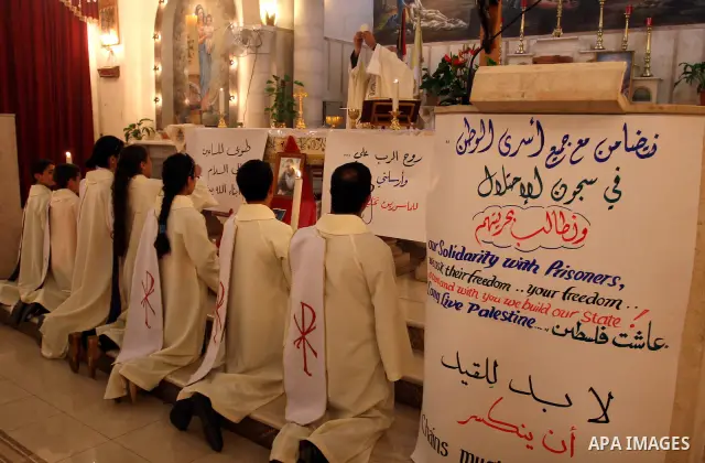 Palestinian Christians attend a special service in support of jailed Palestinians on hunger strike in Israeli prisons at a church in the West Bank city of Ramallah on April 29, 2012. Over the past week, Over 1,350 Palest...