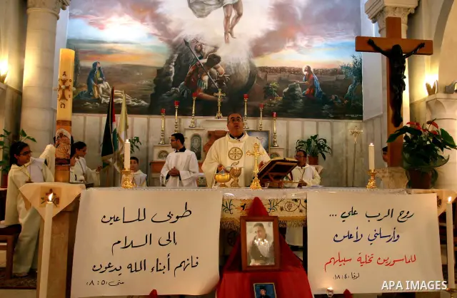 Palestinian Christians attend a special service in support of jailed Palestinians on hunger strike in Israeli prisons at a church in the West Bank city of Ramallah on April 29, 2012. Over the past week, Over 1,350 Palest...