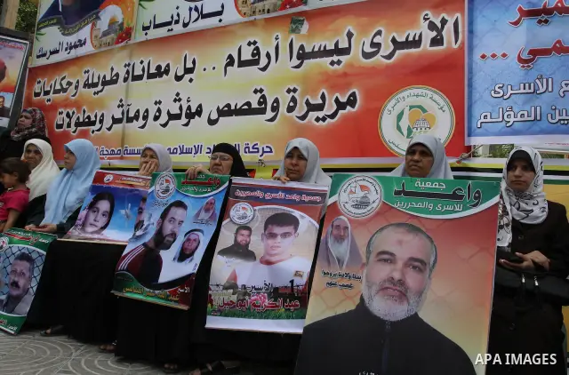 Palestinian women shout slogans during a demonstration for the release of Palestinian prisoners held in Israeli jails in Gaza City on April 30, 2012. At least 1,350 Palestinian prisoners being held in Israel are observin...