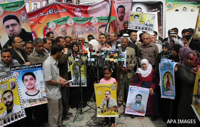 Palestinian official speaks during a demonstration for the release of Palestinian prisoners held in Israeli jails in Gaza City on April 30, 2012. At least 1,350 Palestinian prisoners being held in Israel are observing an...