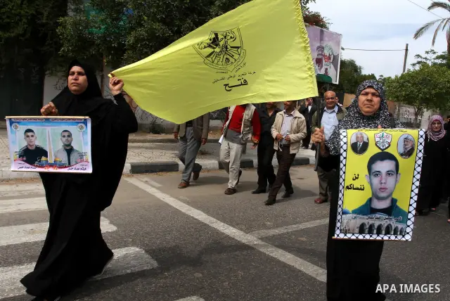 Palestinians shout slogans during a demonstration for the release of Palestinian prisoners held in Israeli jails in Gaza City on April 30, 2012. At least 1,350 Palestinian prisoners being held in Israel are observing an...