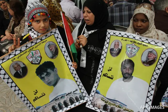 Palestinian women shout slogans during a demonstration for the release of Palestinian prisoners held in Israeli jails in Gaza City on April 30, 2012. At least 1,350 Palestinian prisoners being held in Israel are observin...