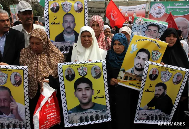 Palestinians shout slogans during a demonstration for the release of Palestinian prisoners held in Israeli jails in Gaza City on April 30, 2012. At least 1,350 Palestinian prisoners being held in Israel are observing an...