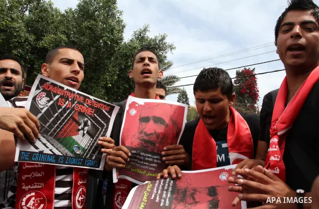 Palestinian youth shout slogans during a demonstration for the release of Palestinian prisoners held in Israeli jails in Gaza City on April 30, 2012. At least 1,350 Palestinian prisoners being held in Israel are observin...