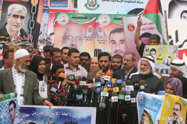 Palestinian official speaks during a demonstration for the release of Palestinian prisoners held in Israeli jails in Gaza City on April 30, 2012. At least 1,350 Palestinian prisoners being held in Israel are observing an...