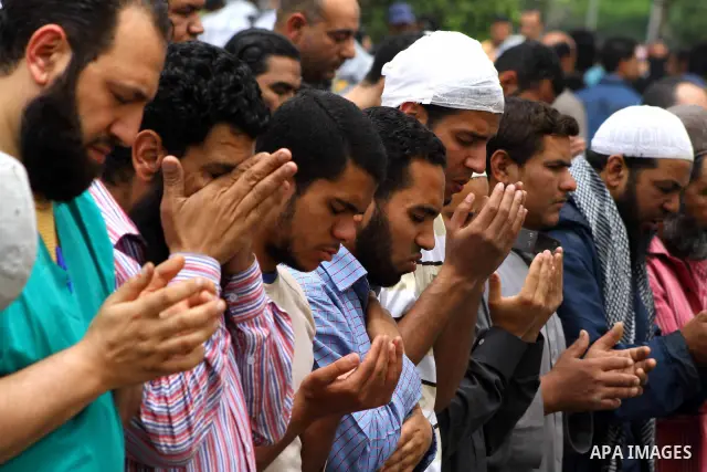 Egyptian Protesters pray near the Ministry of Defense in the Abbassiya district of Cairo April 30, 2012. Protesters continued their sit-in on April 30 after they were attacked two days earlier, which resulted in the deat...