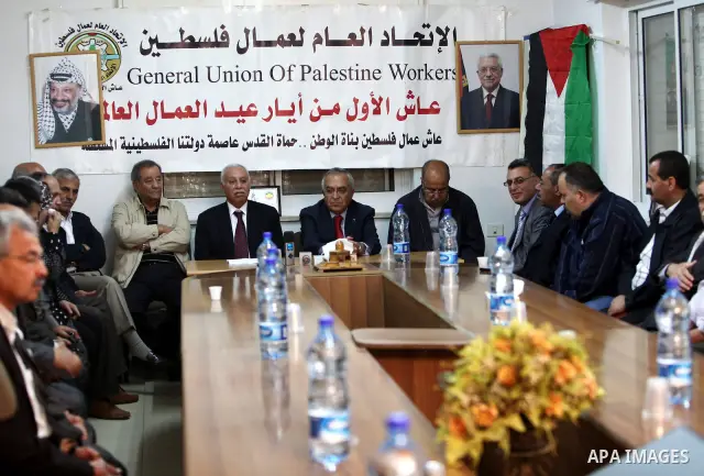 Palestinian prime minister Salam Fayyad participates a meeting " International Workers' Day" at the headquarters of the General Union of Palestine Workers, in the West Bank City of Ramallah, on May 01, 2012. Photo by Mus...