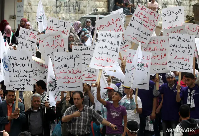 Palestinian workers shouting and calling Palestinian government to improve conditions of workers and create jobs during a protest in the West Bank city of Nablus on May 01,2012. Photo by Nedal shtieh