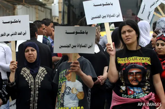 Palestinian workers shouting and calling Palestinian government to improve conditions of workers and create jobs during a protest in the West Bank city of Nablus on May 01,2012. Photo by Nedal shtieh