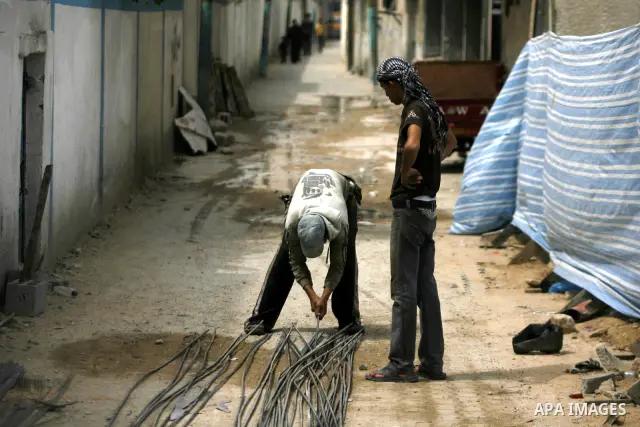 Palestinians work in building participate a protest to mark "workers' Day" in Rafah town In Gaza Strip, on May 01, 2012. Photo by Eyad Al Baba