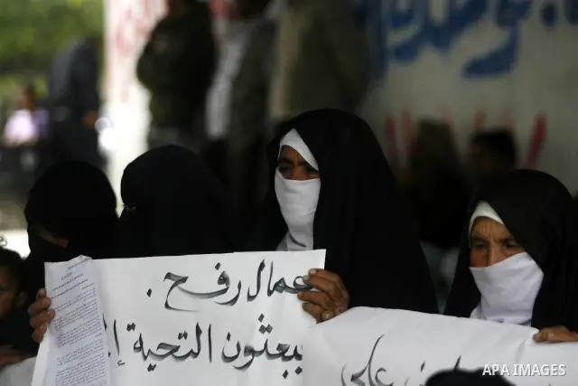 Palestinian women participate a protest to mark "workers' Day" in Rafah town In Gaza Strip, on May 01, 2012. Photo by Eyad Al Baba