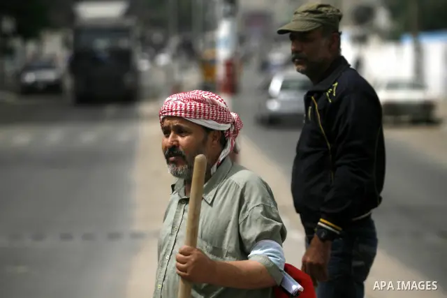Palestinian volunteers cleaning the streets to mark "workers' Day" in Rafah town In Gaza Strip, on May 01, 2012. Photo by Eyad Al Baba