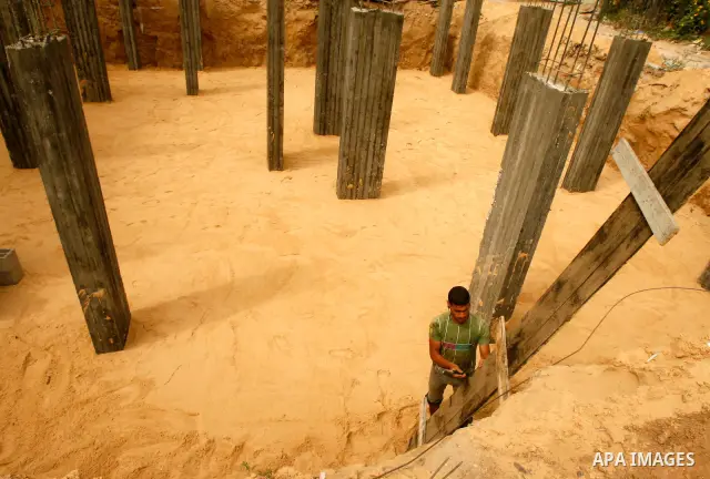 Palestinian construction worker continues his work in "Worker's Day" in Rafah southern Gaza Strip, on May 01, 2012. Photo by Eyad Al Baba