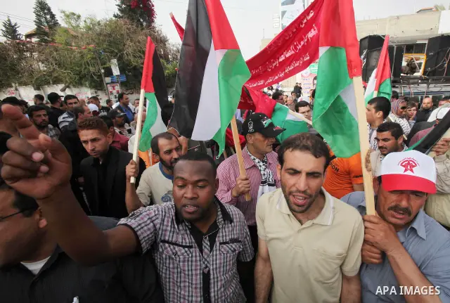 Palestinians shout slogans during a demonstration in "Worker's Day" in Gaza city, against israel's economic blockade of the Gaza Strip was imposed after the militant Hamas group violently seized power in the territory Fi...