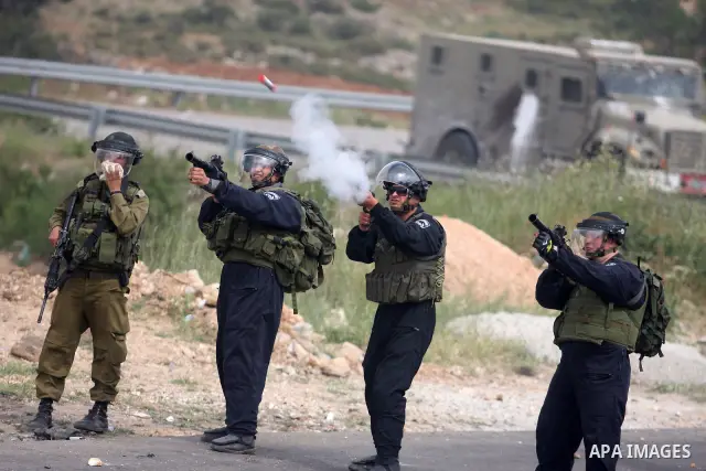 Israeli troops fired tear gas fired near Palestinian stone-throwers during clashes next to the Israeli military prison of Ofer, near Beitunia, West Bank, 02 May 2012. The protesters were protesting in solidarity with the...