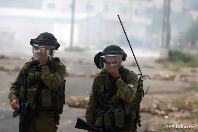Israeli troops fired tear gas fired near Palestinian stone-throwers during clashes next to the Israeli military prison of Ofer, near Beitunia, West Bank, 02 May 2012. The protesters were protesting in solidarity with the...