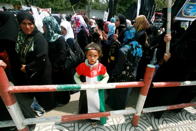 Palestinian women and Children chant slogans during a rally in Gaza City in support of more than a thousand prisoners who are on an open-ended hunger strike in Israeli jails on May 3, 2012. At least 1,550 Palestinians in...