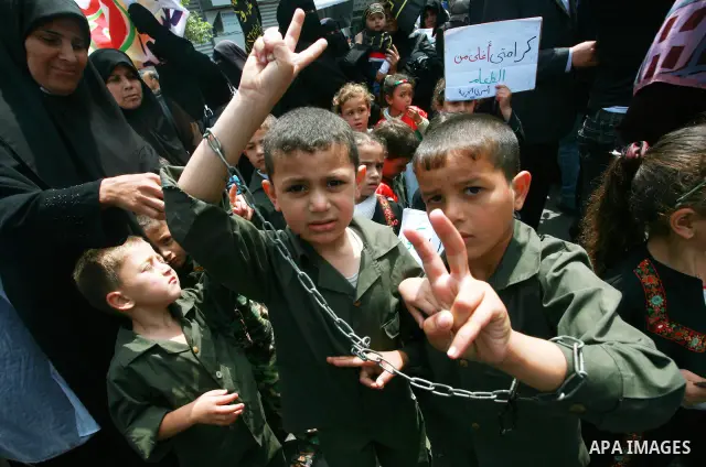 Palestinian Children chant slogans during a rally in Gaza City in support of more than a thousand prisoners who are on an open-ended hunger strike in Israeli jails on May 3, 2012. At least 1,550 Palestinians in Israeli j...