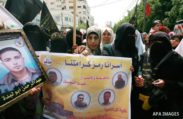 Palestinian women chant slogans during a rally in Gaza City in support of more than a thousand prisoners who are on an open-ended hunger strike in Israeli jails on May 3, 2012. At least 1,550 Palestinians in Israeli jail...