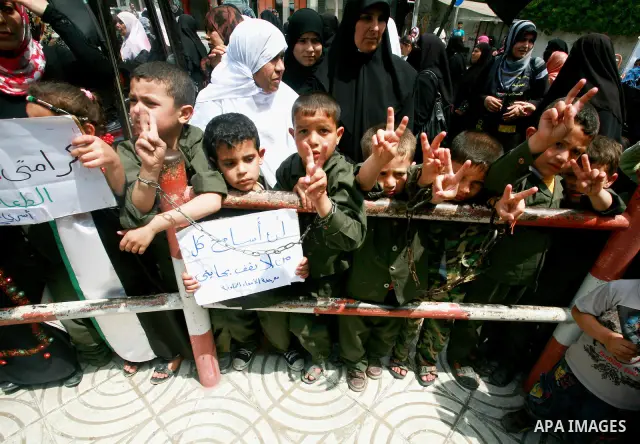 Palestinian women and Children chant slogans during a rally in Gaza City in support of more than a thousand prisoners who are on an open-ended hunger strike in Israeli jails on May 3, 2012. At least 1,550 Palestinians in...