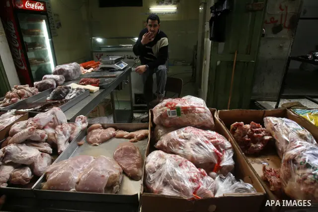 Palestinian butchers slaughter cows in his shop in Rafah, southern Gaza Strip, May 03, 2012. A U.N. agency said Wednesday May 2, 2012 that Egypt's outbreak of foot-and-mouth disease has reached neighboring Gaza Strip and...