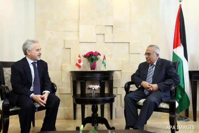 Palestinian Prime Minister Salam Fayyad, meets with Deputy Foreign Minister of Canada, Mr. Morris Rosenberg, in the West Bank City of Ramallah, on May 03, 2012. Photo by Mustafa Abu Dayeh