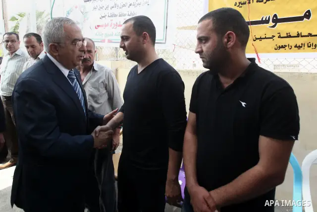 Palestinian Prime Minister Salam Fayyad, offers the condolences on the death of the Governor of Jenin, in the West Bank City of Ramallah, on May 03, 2012. Photo by Mustafa Abu Dayeh