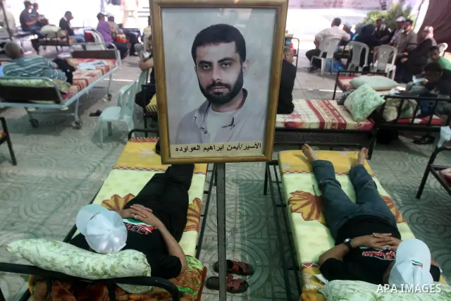 Palestinians participat at hunger striking during a sit-in tent held by Palestinian released prisoners, solidarity with Palestinian prisoners held in Israeli jails, in Gaza City on May 3, 2012. Over the past week, Over t...