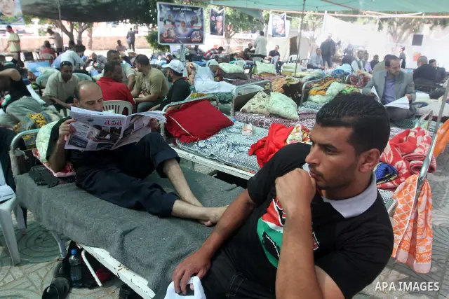 Palestinians participat at hunger striking during a sit-in tent held by Palestinian released prisoners, solidarity with Palestinian prisoners held in Israeli jails, in Gaza City on May 3, 2012. Over the past week, Over t...