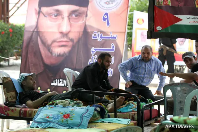 Palestinians participat at hunger striking during a sit-in tent held by Palestinian released prisoners, solidarity with Palestinian prisoners held in Israeli jails, in Gaza City on May 3, 2012. Over the past week, Over t...