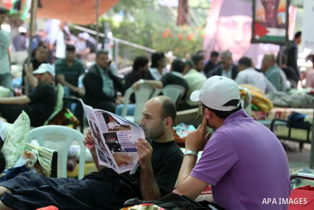 Palestinians participat at hunger striking during a sit-in tent held by Palestinian released prisoners, solidarity with Palestinian prisoners held in Israeli jails, in Gaza City on May 3, 2012. Over the past week, Over t...
