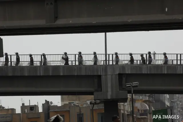 May 4, 2012 - Cairo, Egypt - Egyptian riot police deploy on a bridge near the Ministry of Defense ahead of the 'Final Friday' marches planned for May 4, 2012 in the Abasseya neighborhood of Cairo. The 'Final Friday' prot...